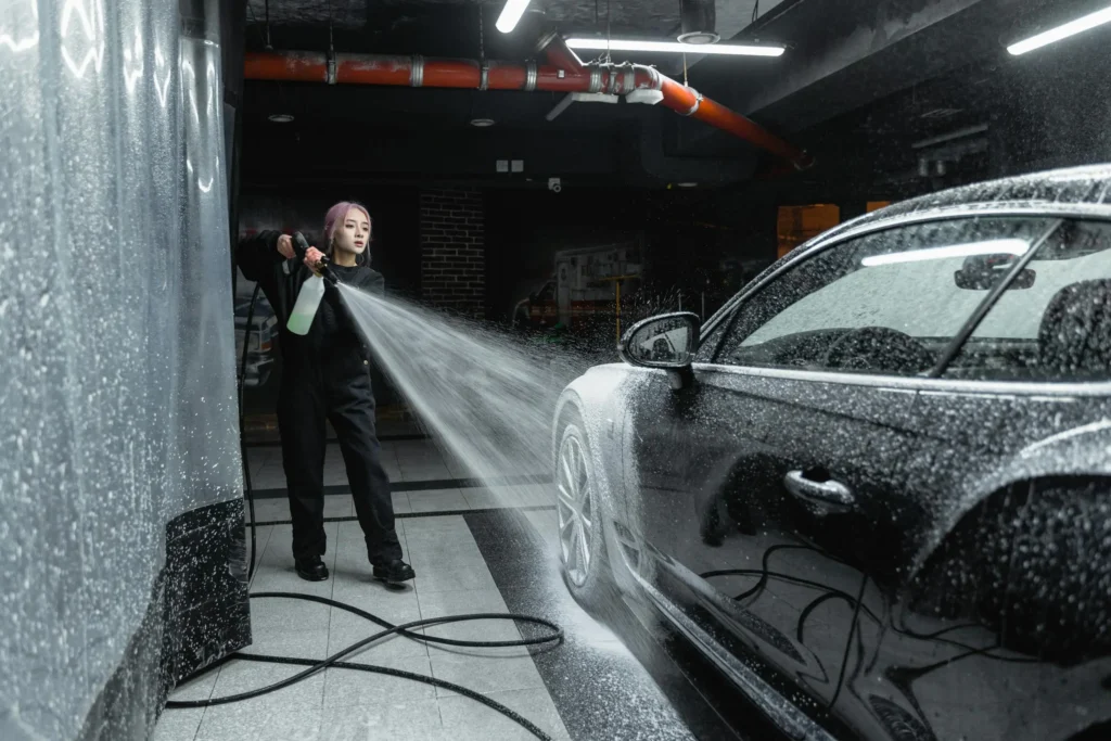 photo of a woman washing a black car 6873079 scaled 1